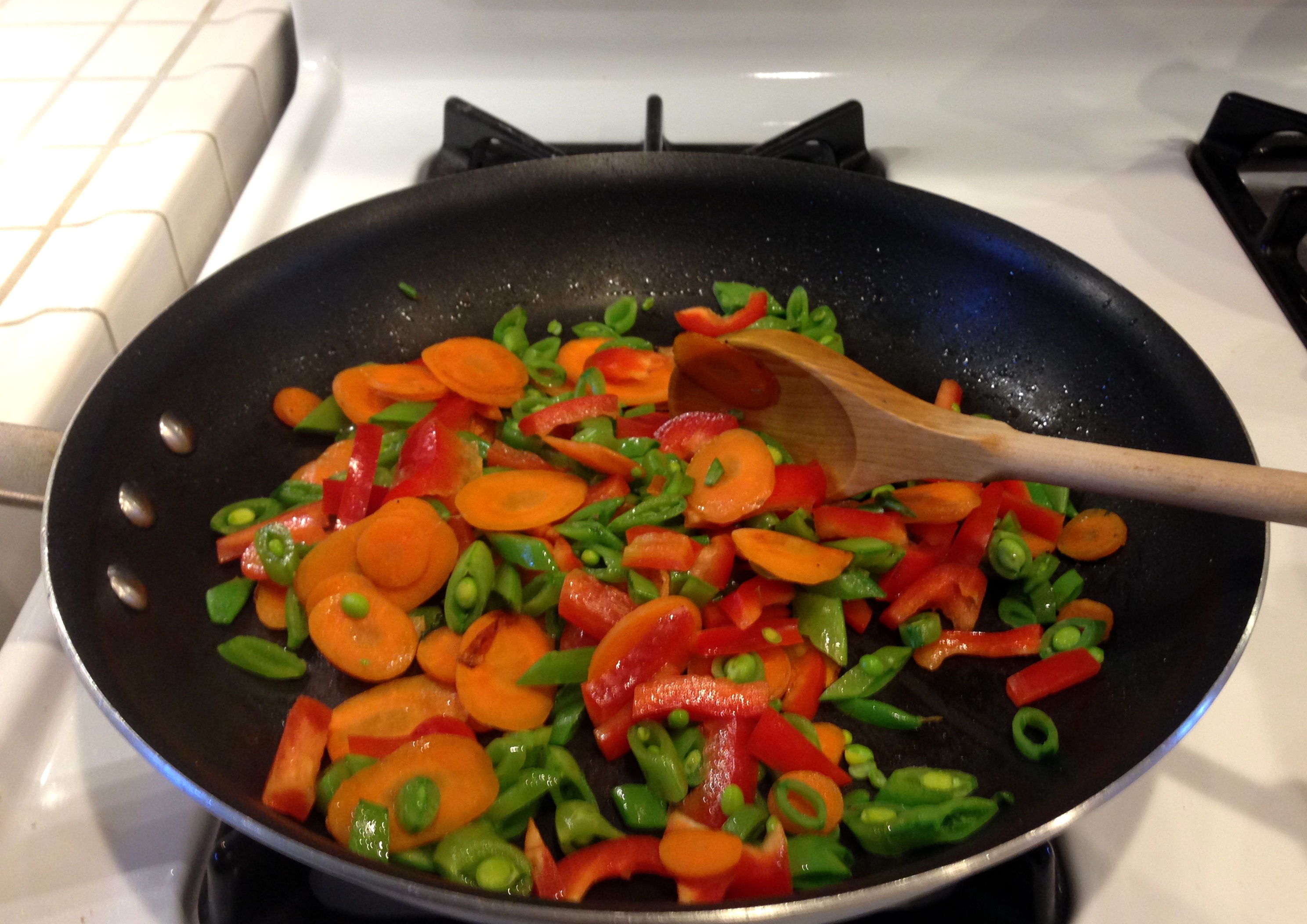 Add snap peas and peppers