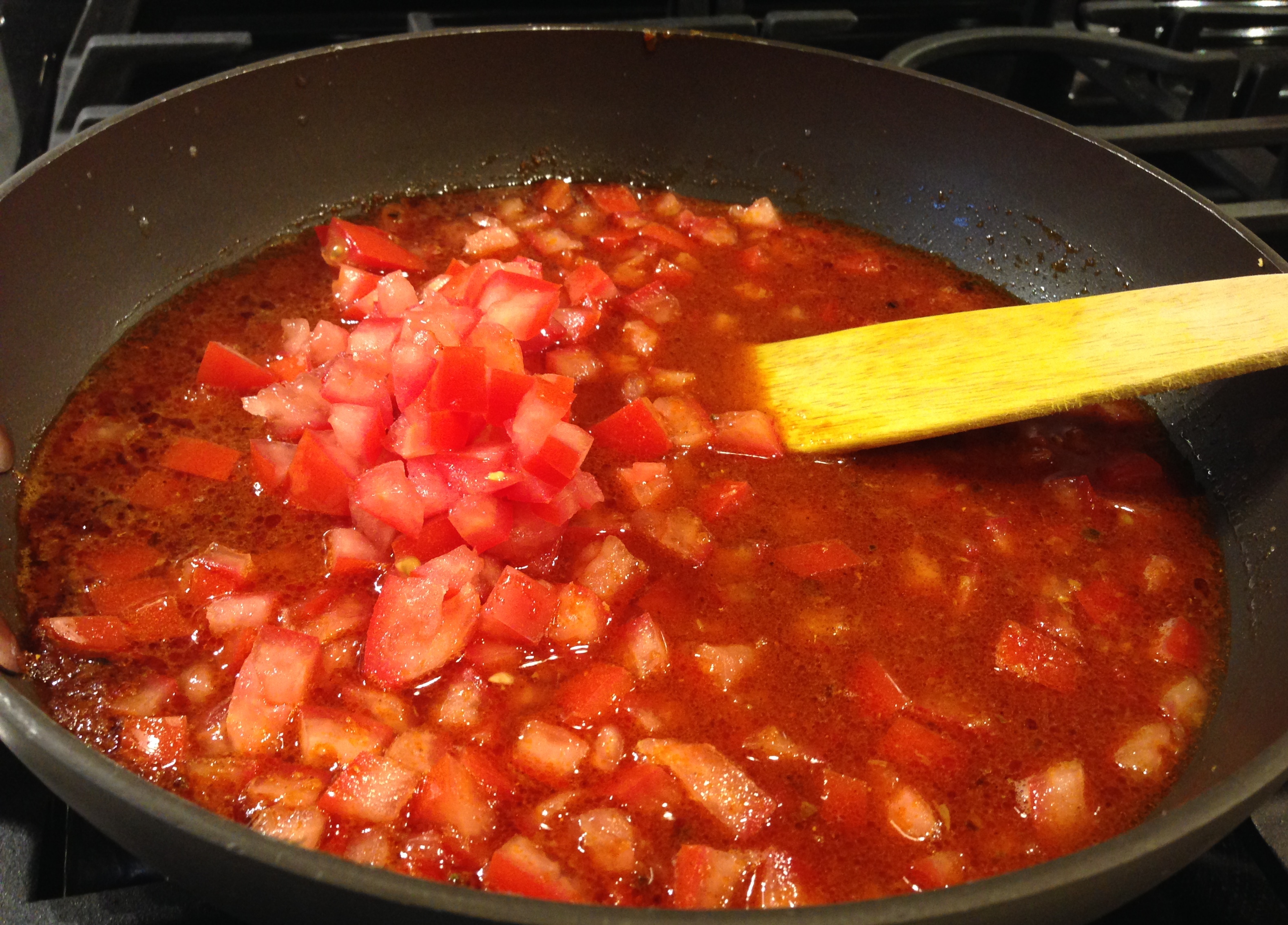 Add tomatoes to sauce