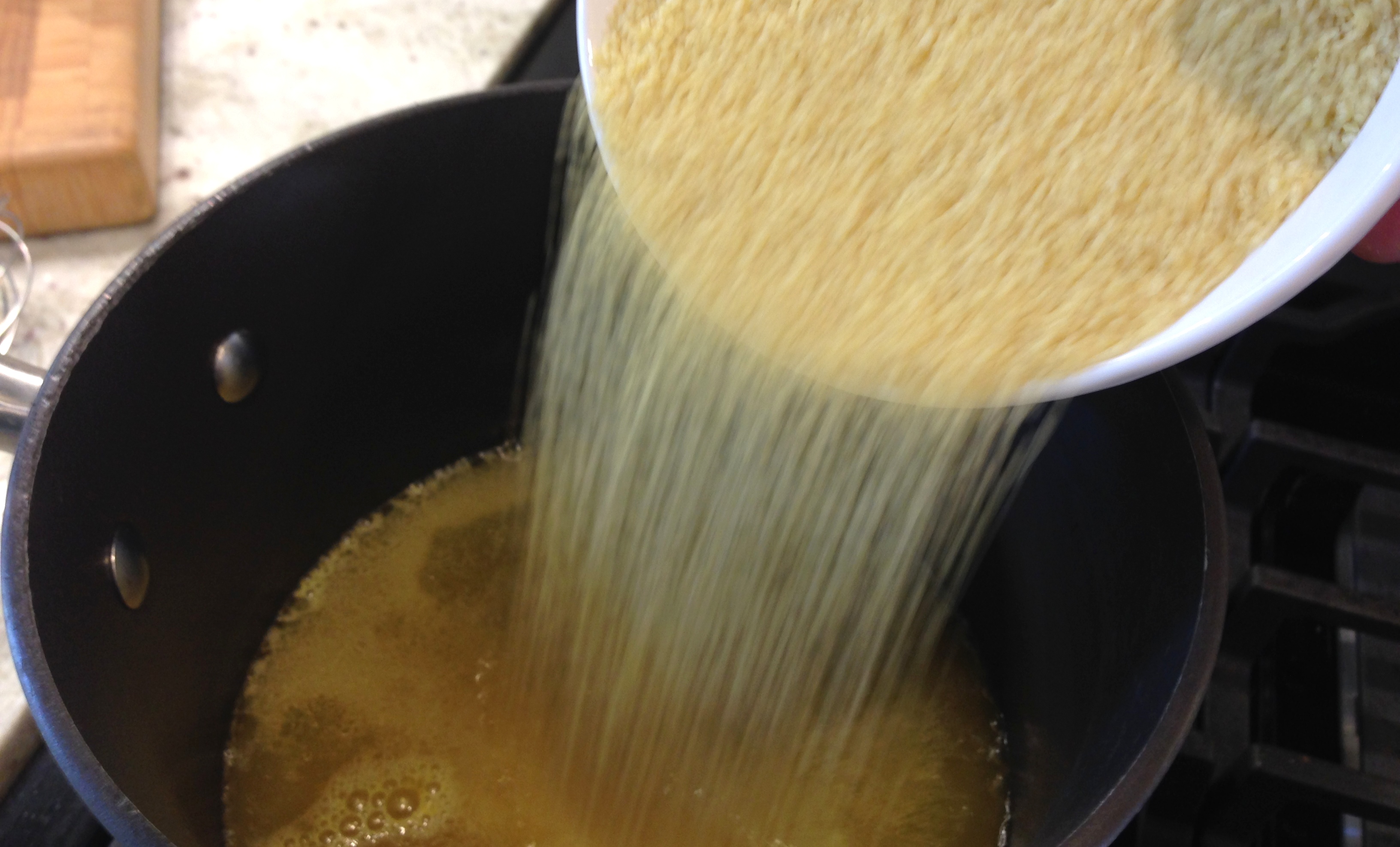 Add couscous to chicken broth