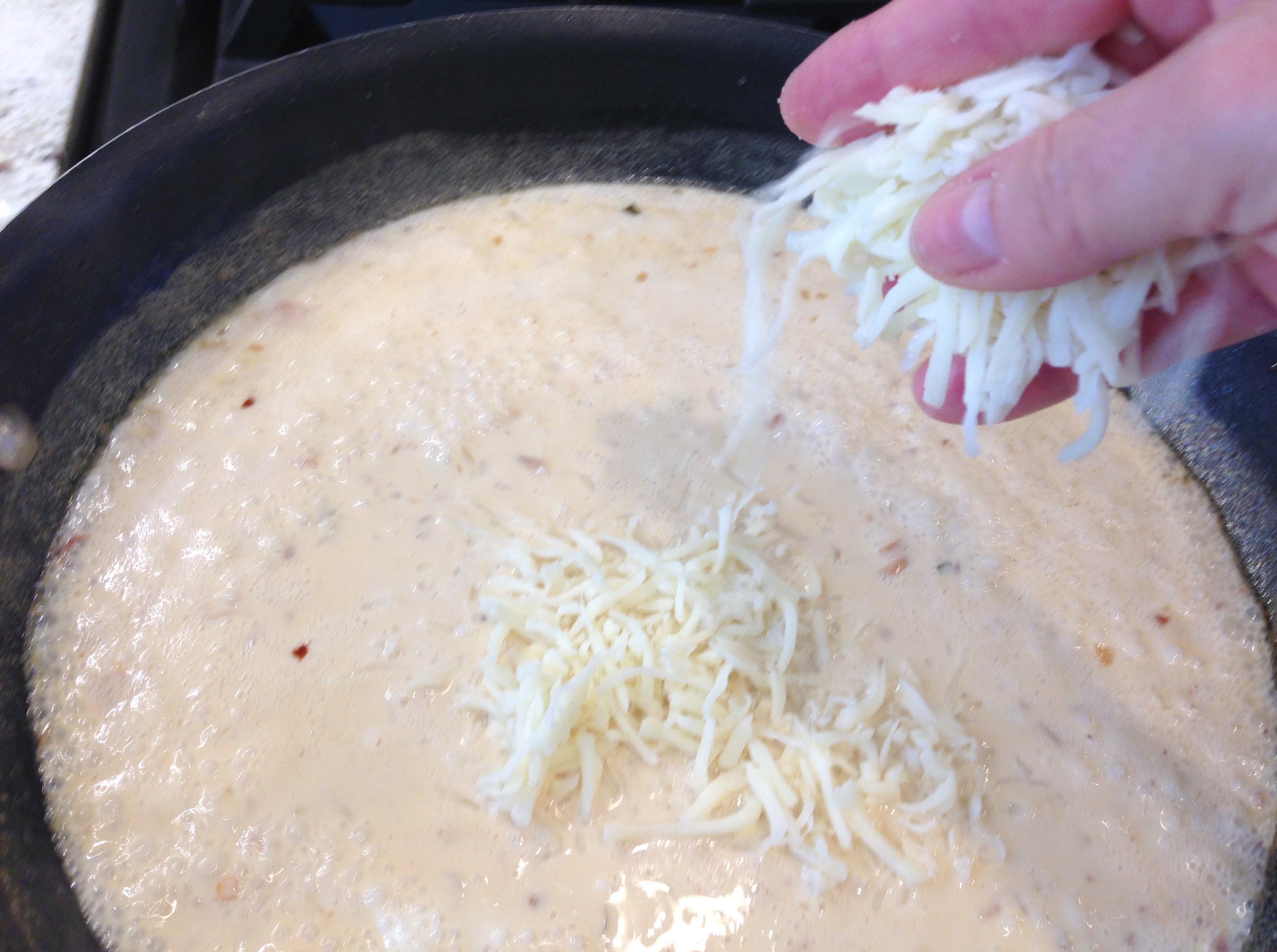 Add cheese to sauce