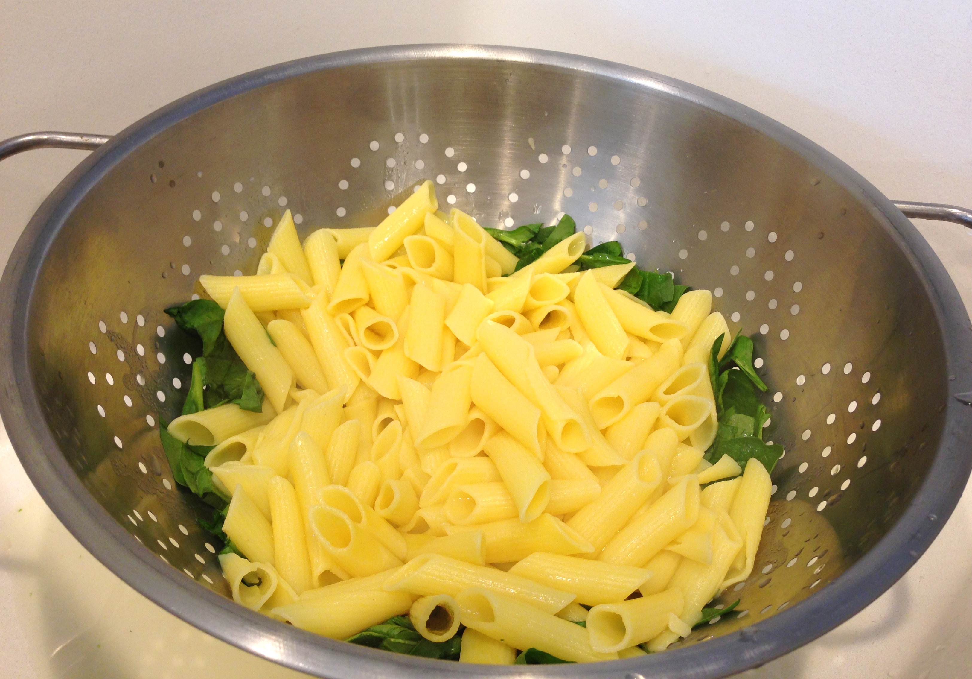 Drain pasta over spinach