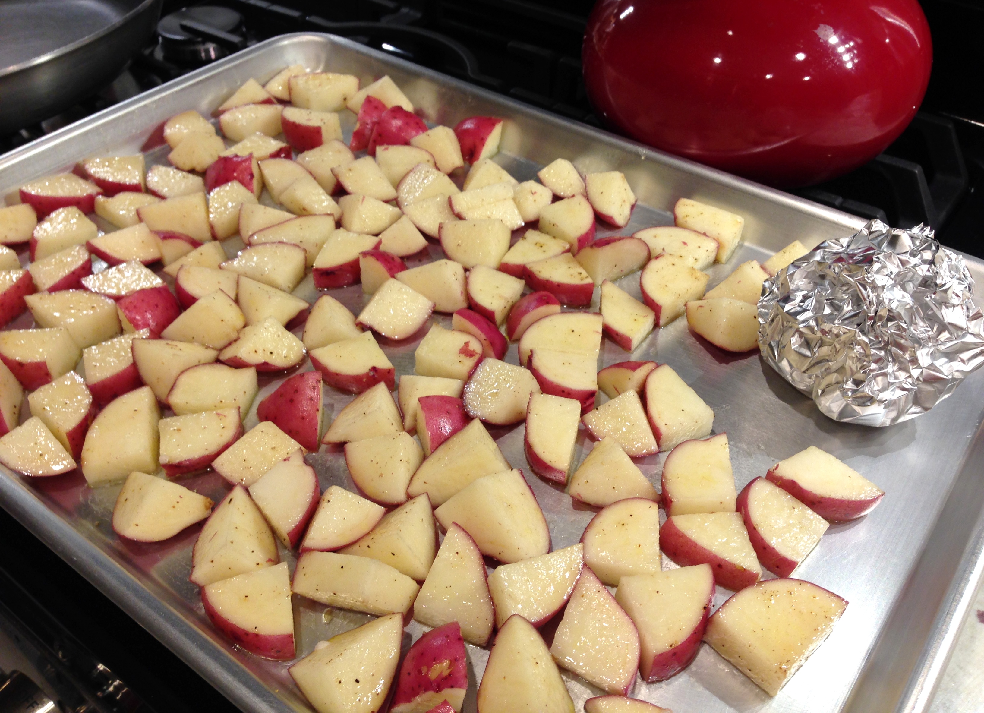 Potaotes and garlic on pan