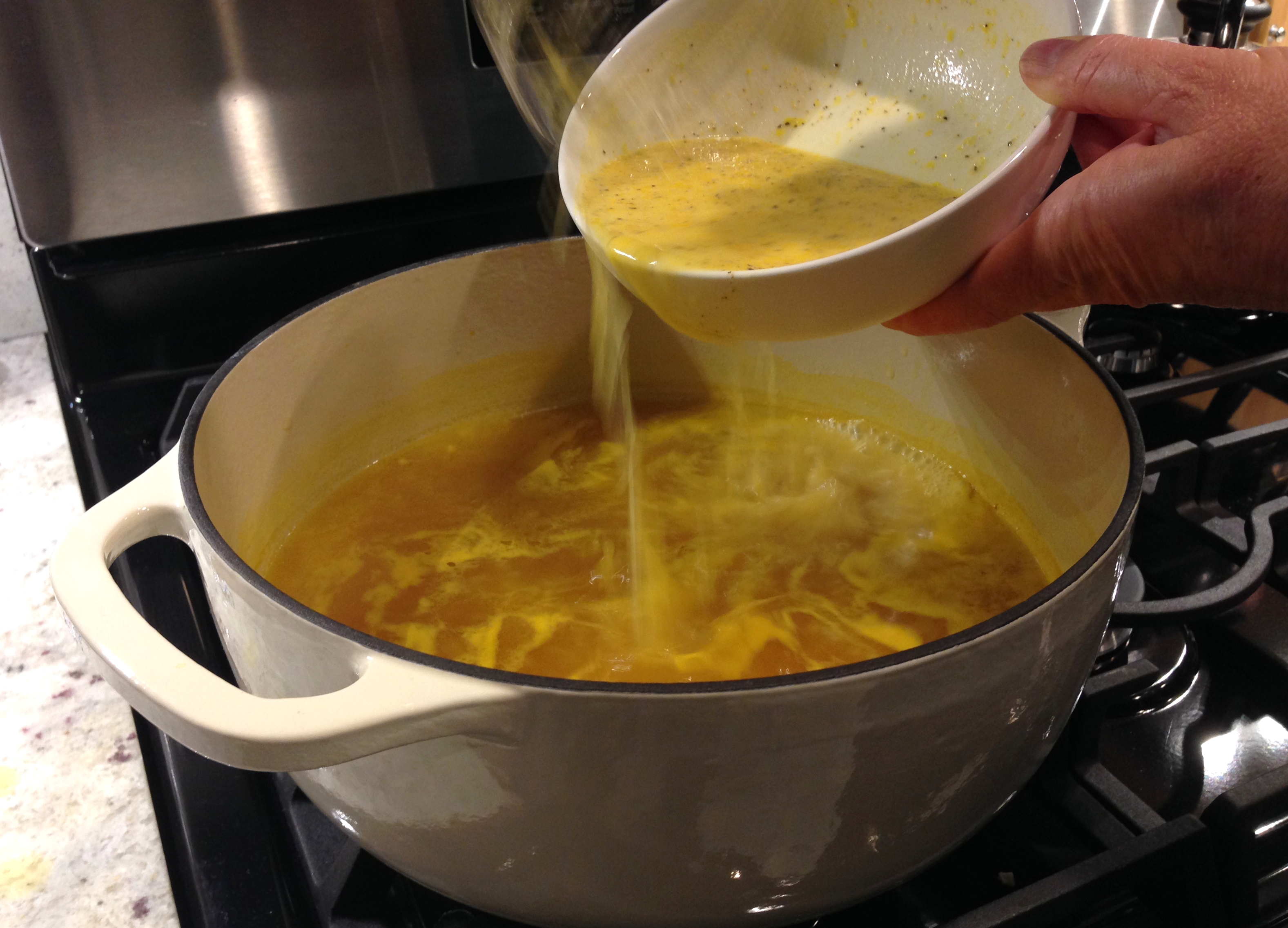 Add egg mixture to broth