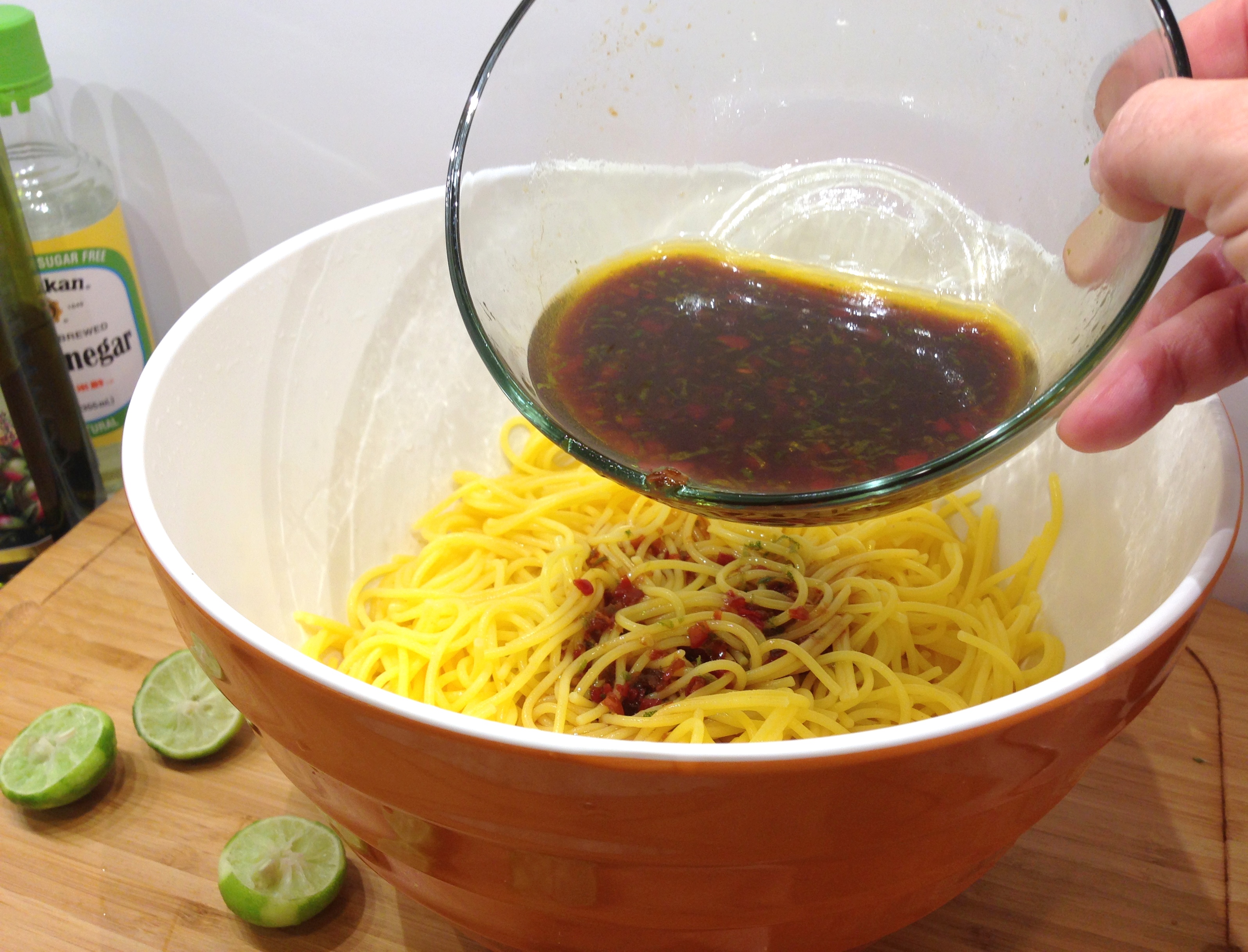 Toss noodles in dressing